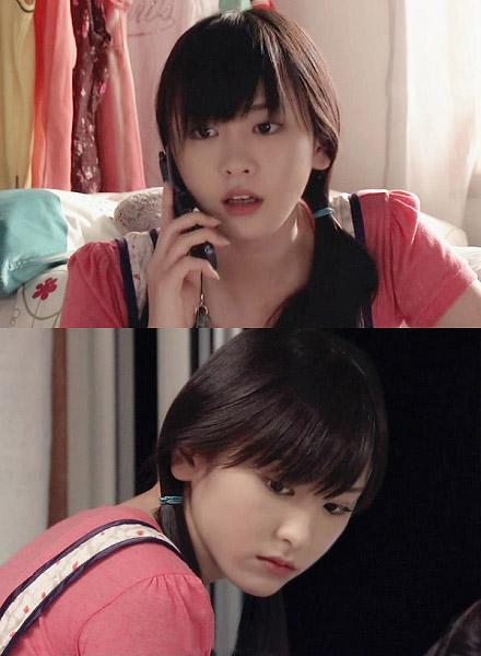 新垣结衣留着单马尾接电话的剧照