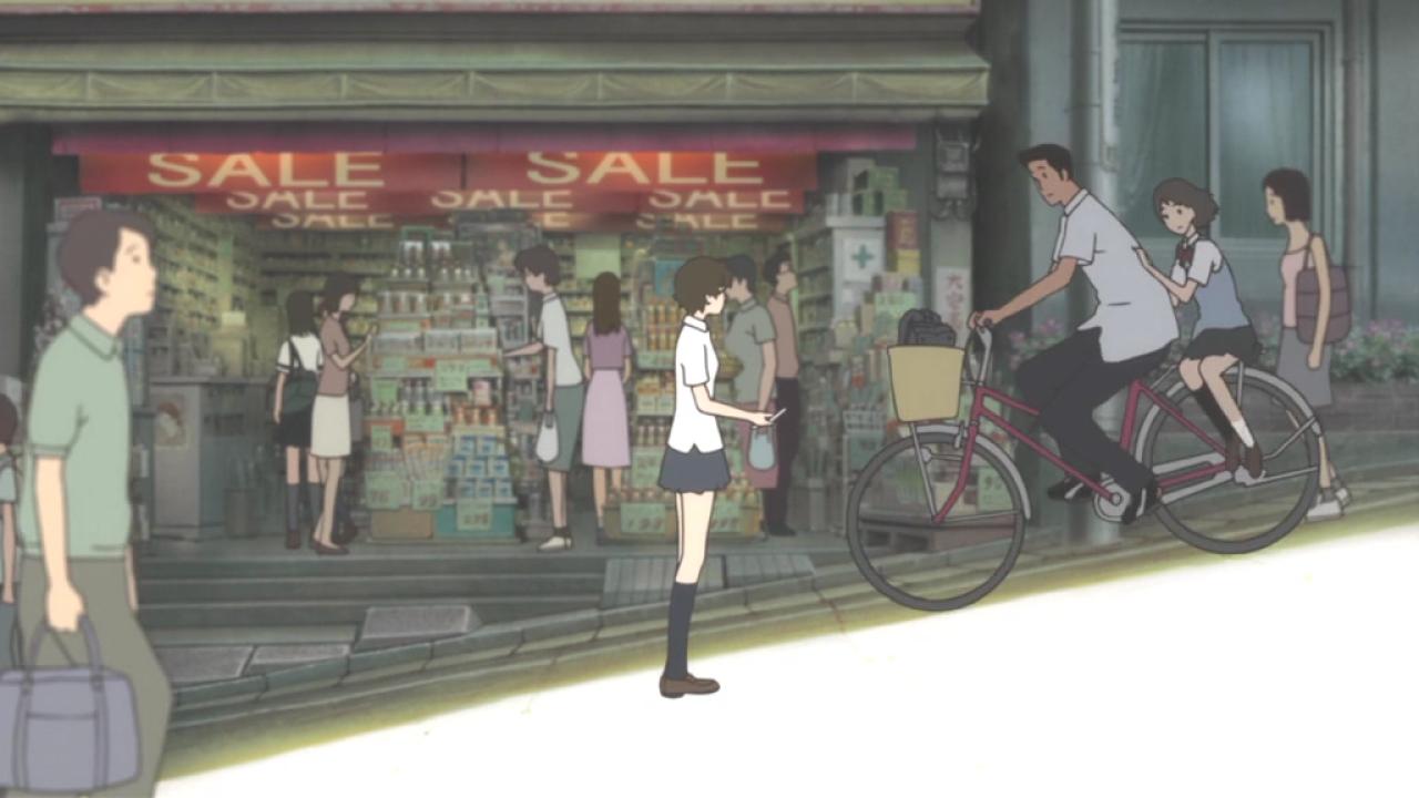 功介骑车带着果穗从真琴身旁经过